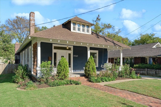 view of front of property with a front lawn and a porch