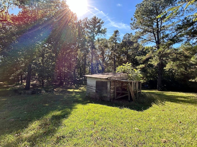11361 Macon Rd, Eads, TN 38028 - view of green lawn with an outbuilding and a storage unit