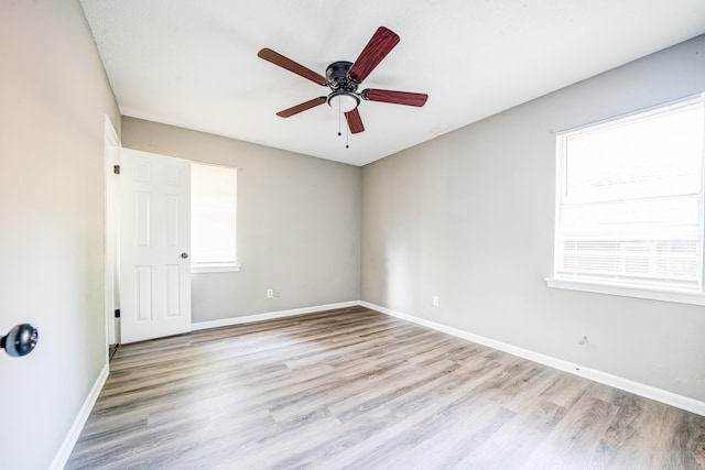 unfurnished room with light hardwood / wood-style floors and ceiling fan