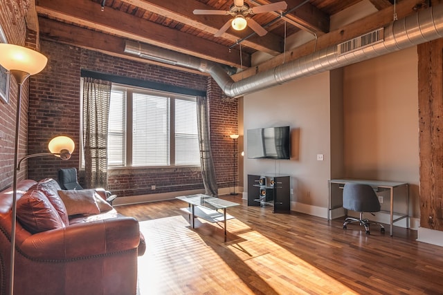 living room featuring wood ceiling, beamed ceiling, brick wall, hardwood / wood-style floors, and ceiling fan