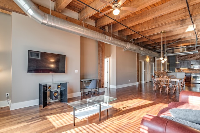 living room featuring wood ceiling, beam ceiling, wood-type flooring, and ceiling fan