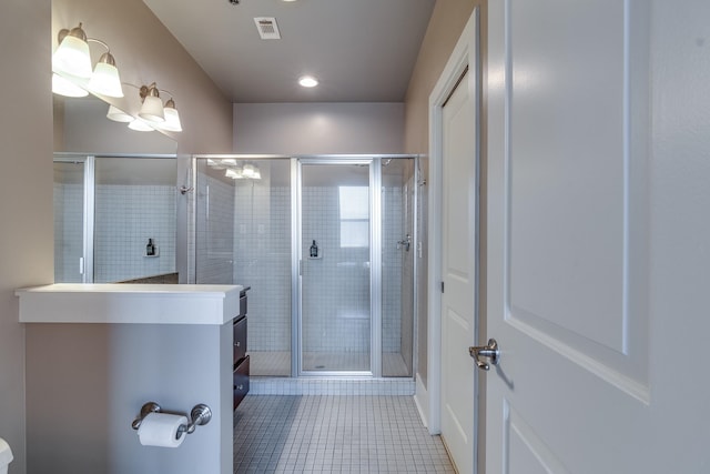 bathroom with vanity, tile patterned flooring, and an enclosed shower