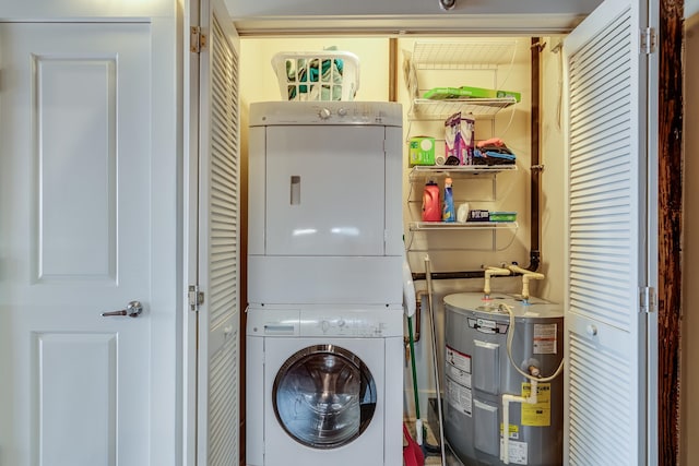 laundry area with water heater and stacked washing maching and dryer