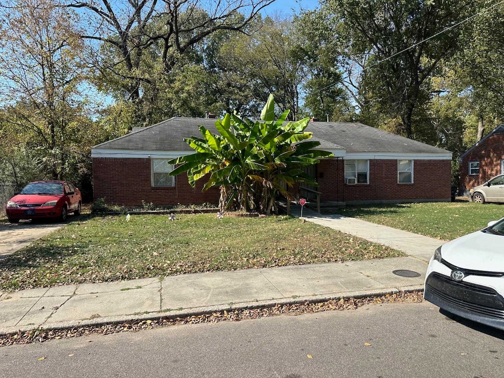 ranch-style house with a front lawn