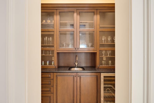 bar with wine cooler and sink