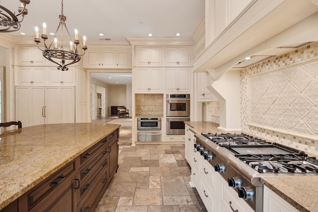 kitchen with backsplash, hanging light fixtures, stainless steel appliances, dark brown cabinetry, and light stone counters