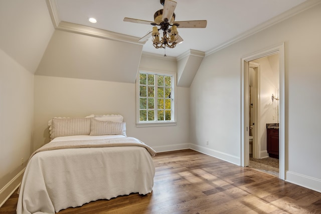 bedroom featuring crown molding, hardwood / wood-style flooring, connected bathroom, and ceiling fan