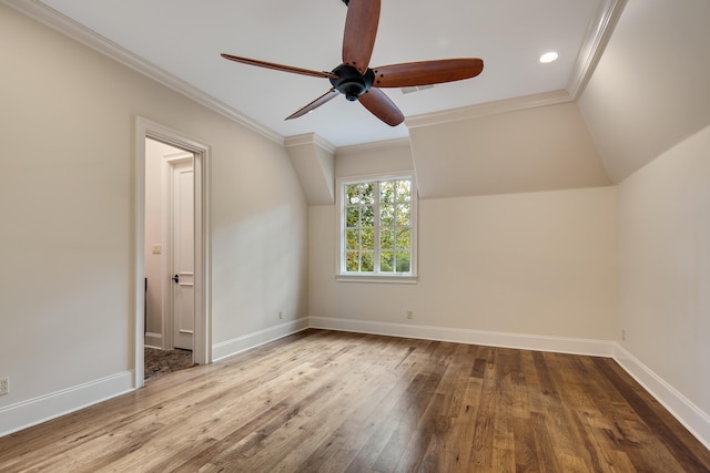 additional living space with ceiling fan, vaulted ceiling, and light hardwood / wood-style flooring