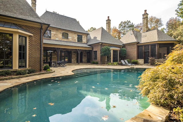 214 Mountain Brook Cv, Eads, TN 38028 - outdoor pool with a sunroom and a patio