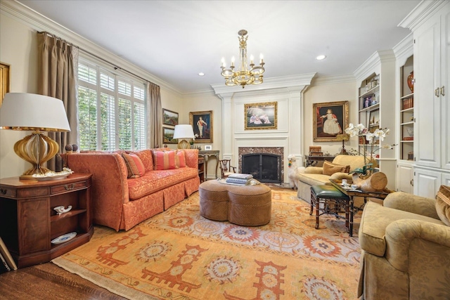 living room with ornamental molding, a chandelier, and hardwood / wood-style floors