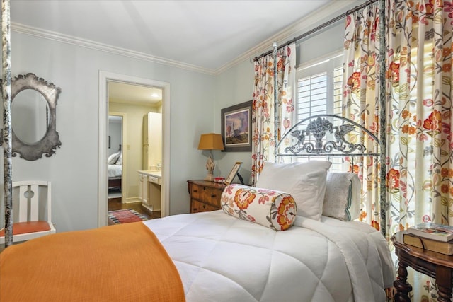 bedroom featuring crown molding and connected bathroom