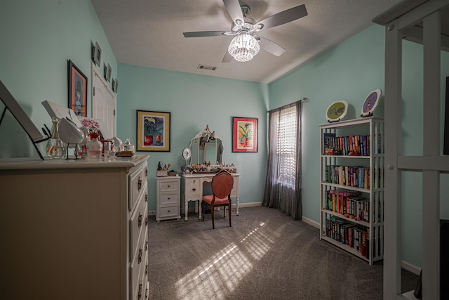 office area featuring carpet flooring, a textured ceiling, and ceiling fan