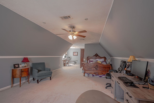 bedroom with a textured ceiling, light carpet, ceiling fan, and vaulted ceiling