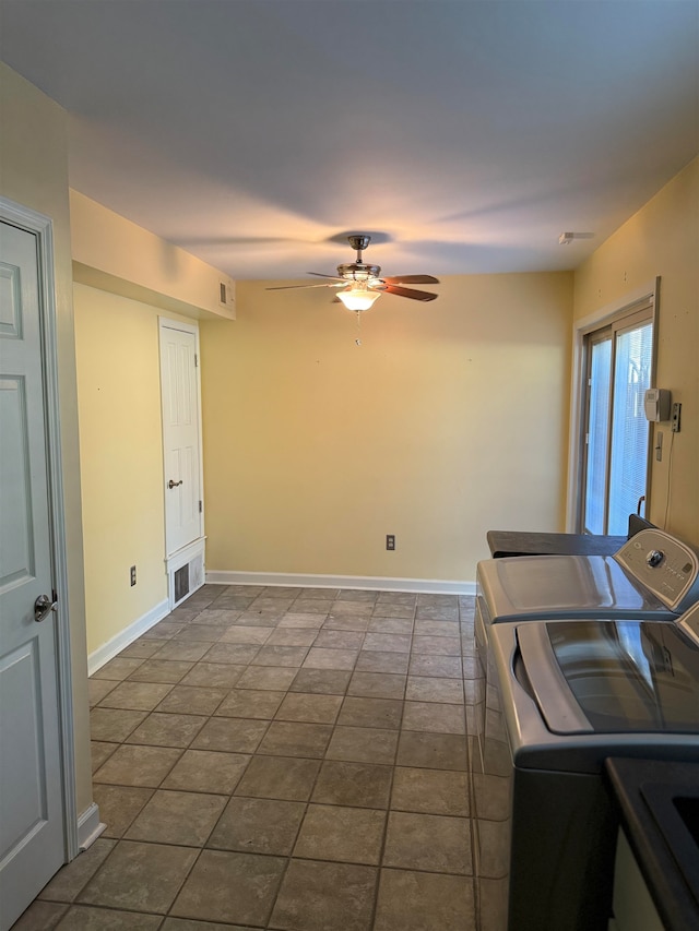 clothes washing area with ceiling fan, tile patterned floors, and washer and clothes dryer