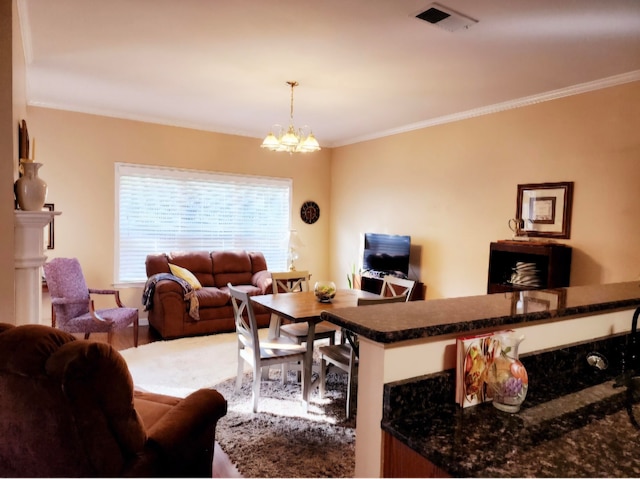 living room featuring ornamental molding, a chandelier, and hardwood / wood-style floors