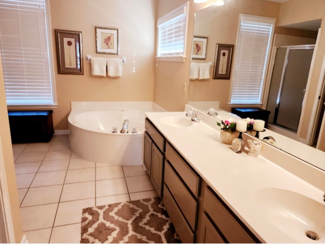 bathroom with vanity, shower with separate bathtub, and tile patterned floors