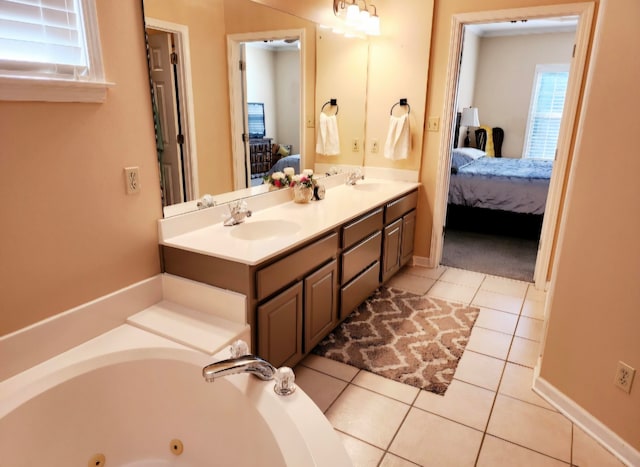 bathroom featuring vanity, tile patterned floors, and a tub to relax in