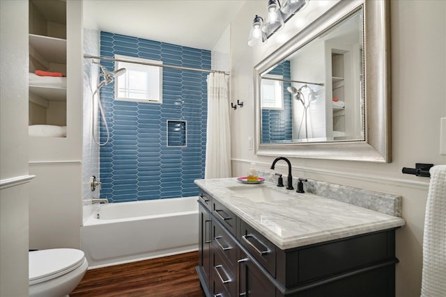 full bathroom featuring vanity, toilet, shower / bath combo, and hardwood / wood-style floors