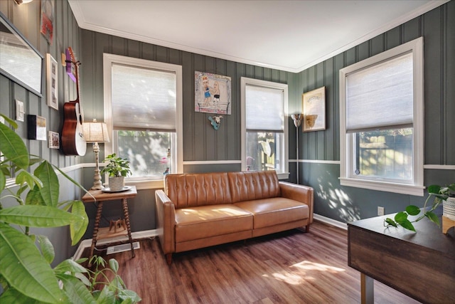 interior space with ornamental molding and wood-type flooring