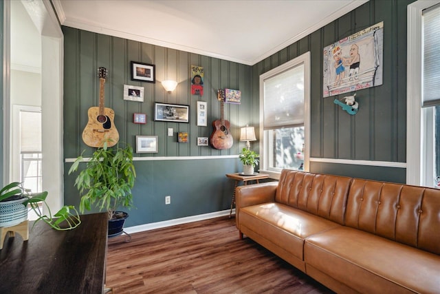 sitting room featuring crown molding and hardwood / wood-style flooring