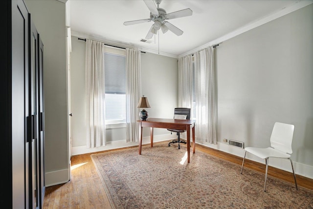 office area with ceiling fan, hardwood / wood-style flooring, and ornamental molding