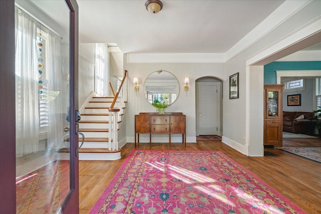 entryway featuring a wealth of natural light and hardwood / wood-style floors