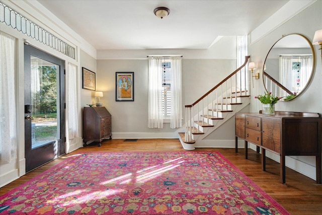 foyer entrance with hardwood / wood-style floors