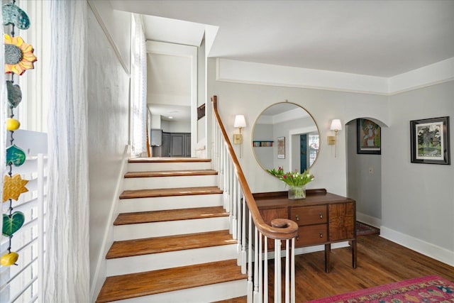 staircase featuring hardwood / wood-style flooring