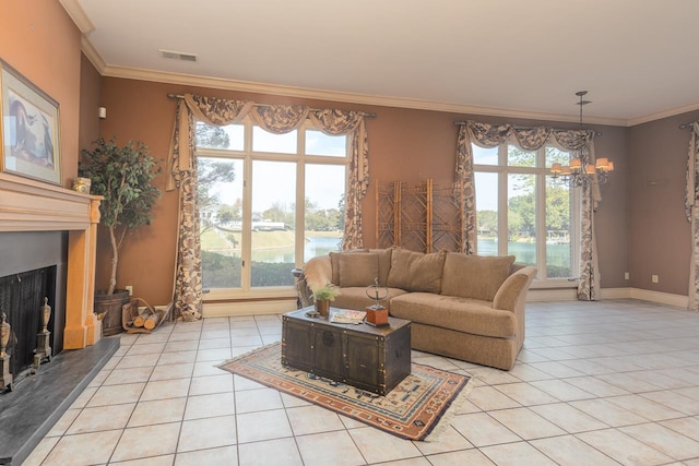 tiled living room with an inviting chandelier, ornamental molding, a healthy amount of sunlight, and a water view