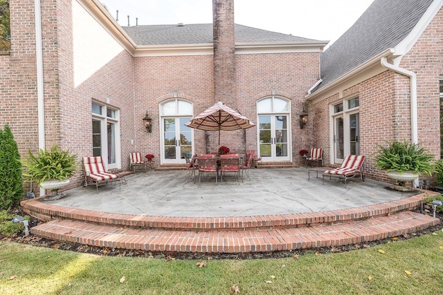 back of house featuring a patio and french doors