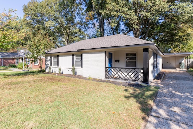 ranch-style home featuring a front yard and covered porch