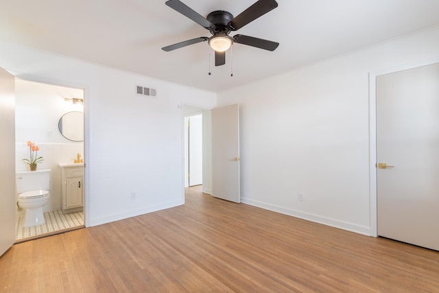 unfurnished bedroom with connected bathroom, light hardwood / wood-style floors, crown molding, and ceiling fan