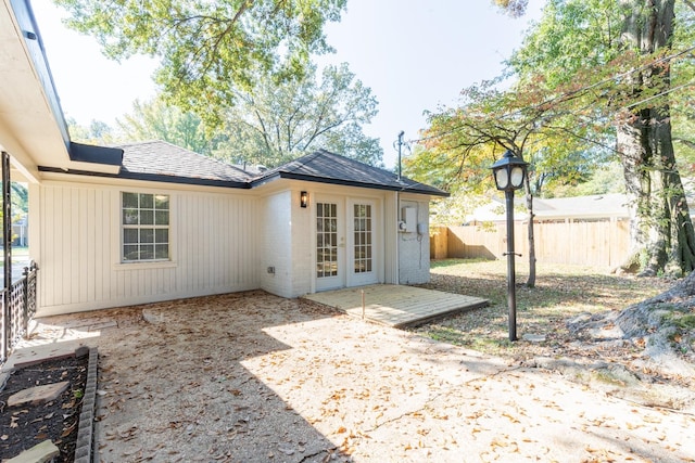 rear view of house with french doors and a patio