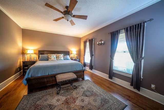 bedroom with ceiling fan, crown molding, a textured ceiling, and hardwood / wood-style floors