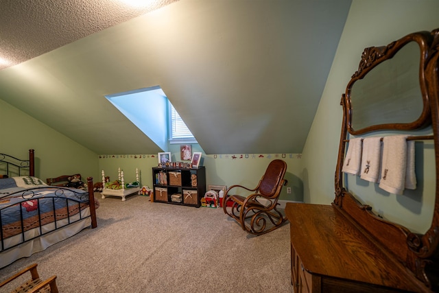 bedroom featuring lofted ceiling with skylight and carpet