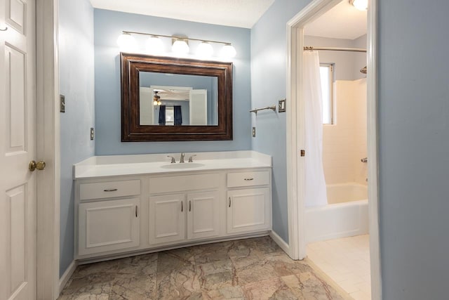 bathroom with vanity, a textured ceiling, and shower / bath combo