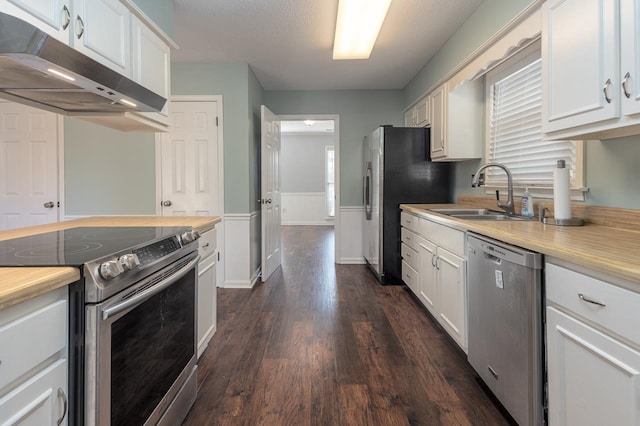 kitchen featuring white cabinets, stainless steel appliances, and sink