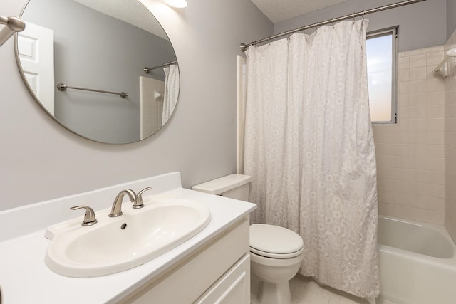 full bathroom with vanity, toilet, a textured ceiling, and shower / tub combo