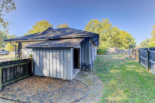 view of outdoor structure with a lawn