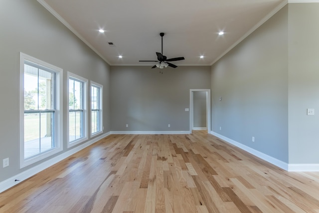 unfurnished room featuring ceiling fan, ornamental molding, and light wood-type flooring