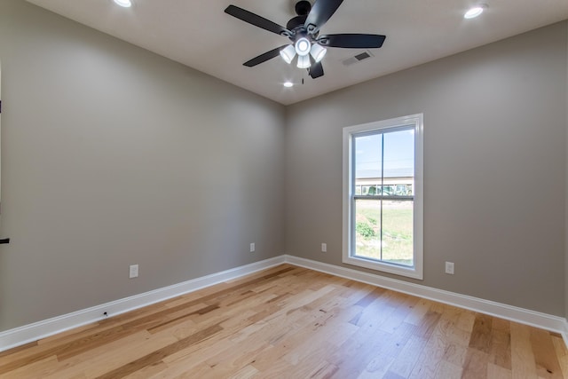 spare room featuring ceiling fan and light wood-type flooring