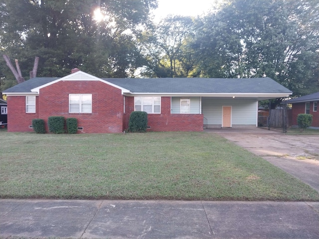 ranch-style house with a front yard and a carport