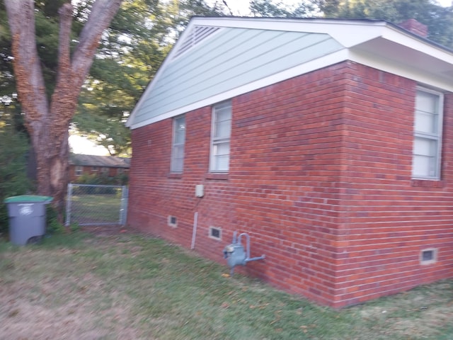 3811 Patte Ann Dr, Memphis, TN 38116 - view of side of home featuring brick siding and a gate
