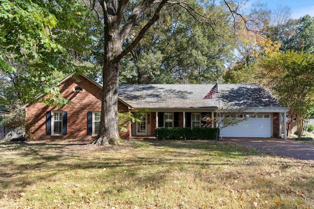 ranch-style house with a front yard and a garage