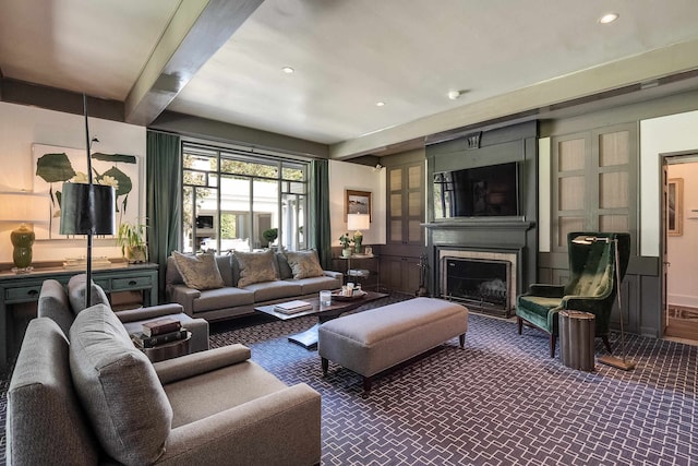 living room with carpet and beamed ceiling