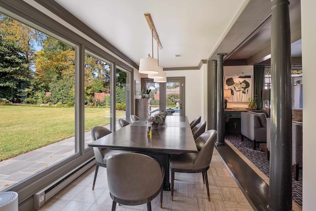 sunroom / solarium featuring a baseboard heating unit