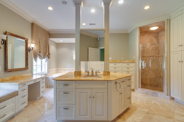 bathroom featuring vanity, a tile shower, crown molding, and decorative columns