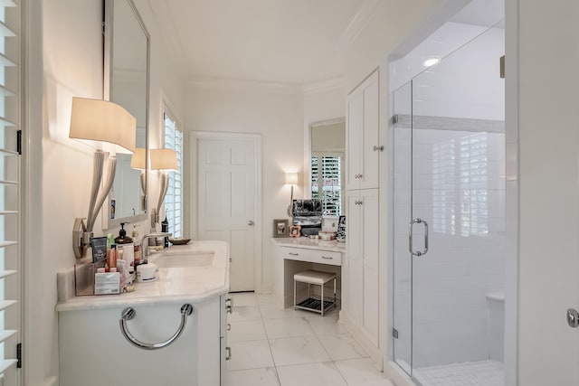 bathroom with vanity, a shower with shower door, ornamental molding, and plenty of natural light