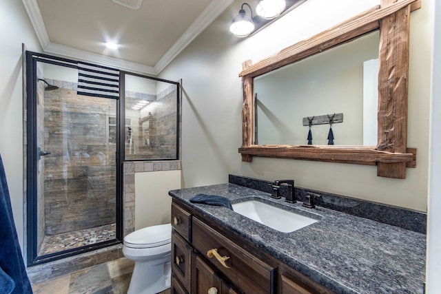 bathroom with vanity, ornamental molding, toilet, and walk in shower