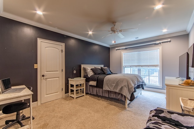 carpeted bedroom featuring crown molding and ceiling fan